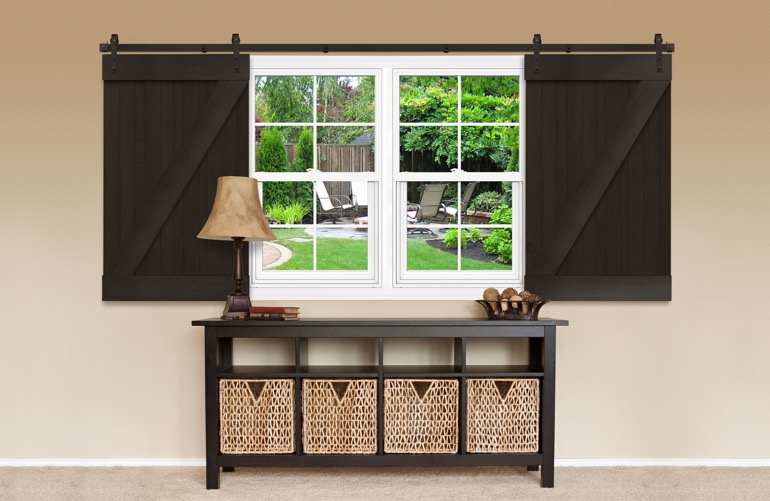 Brown Z-frame sliding barn doors on a window 